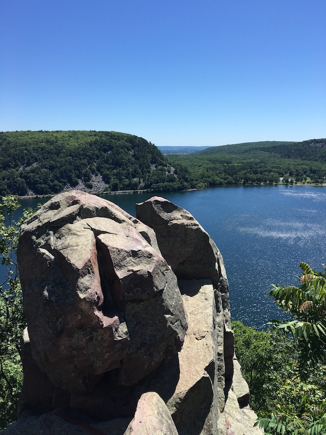 Photo of rocky outctoppings over a lake
